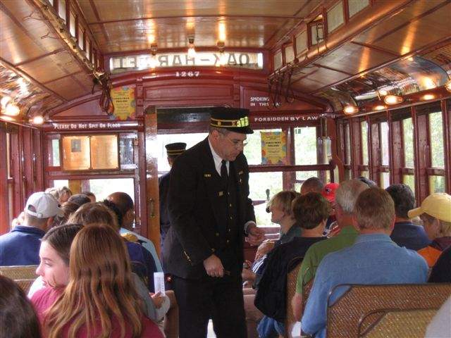 Photo of Conductor Hooper punches tickets en route to the Pumpkin Patch