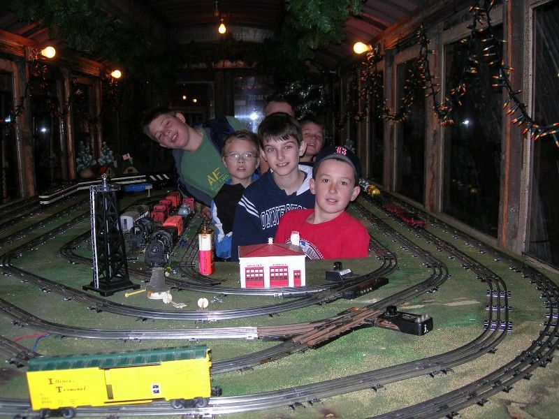 Photo of Inside of trolley decorated for Christmas with a visit from some kids.