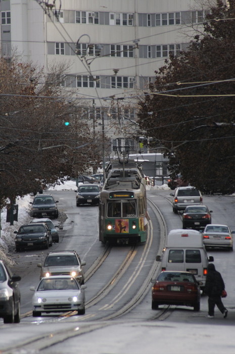 Photo of An E line Huntington Ave Train descends the hill from the VA Med. Center