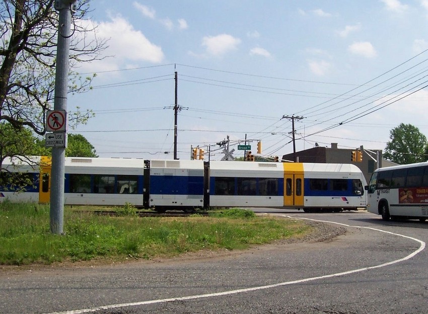 Photo of NJT RiverLine light transit car crosses intersection