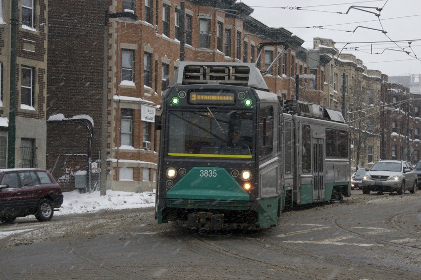 Photo of MBTA type 8 rounds the curve off South Huntington Ave