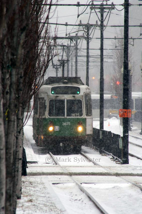 Photo of An outbound E train dashes through the snow